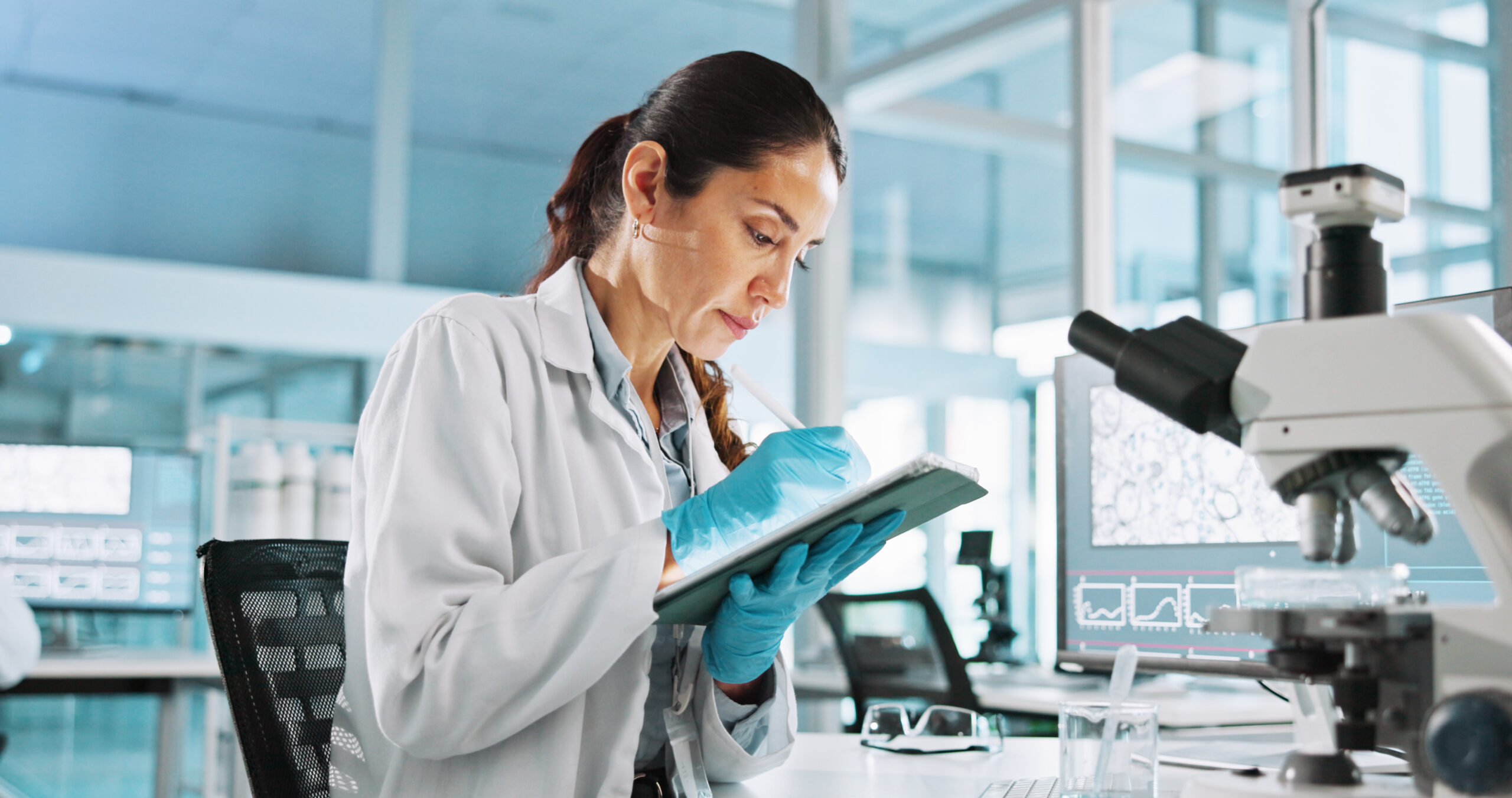 Scientist sitting at a bench